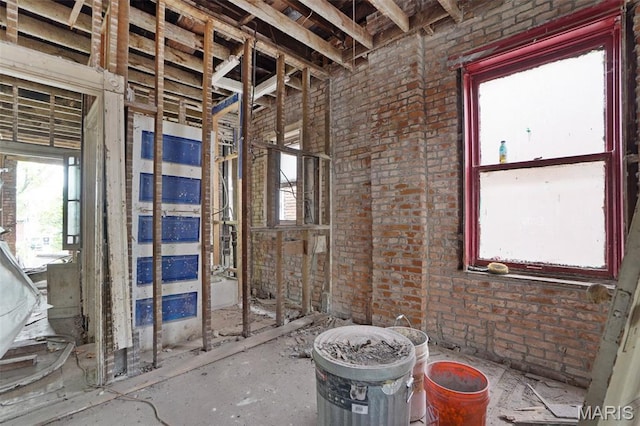 5718 Etzel Ave, Saint Louis, MO 63112 - miscellaneous room with plenty of natural light and brick wall