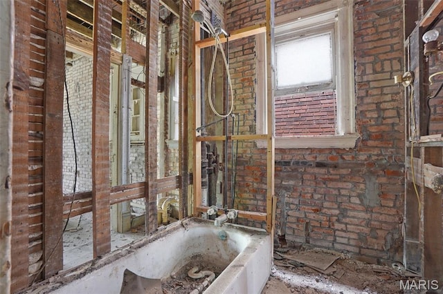 5718 Etzel Ave, Saint Louis, MO 63112 - bathroom featuring brick wall and a bathtub