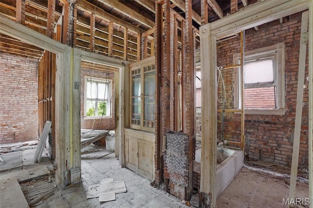 5718 Etzel Ave, Saint Louis, MO 63112 - miscellaneous room featuring brick wall