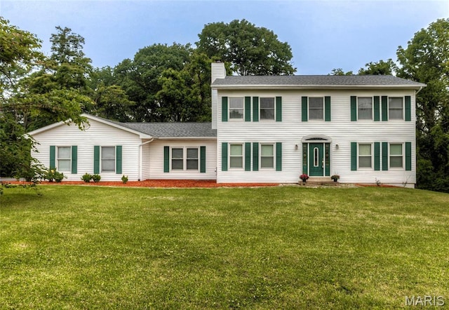 17560 Old Jamestown Rd, Florissant, MO 63034 - colonial inspired home with a chimney, a front lawn, and a shingled roof