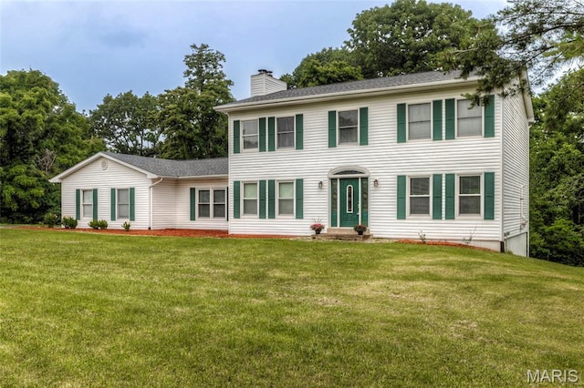 17560 Old Jamestown Rd, Florissant, MO 63034 - colonial home with a chimney, a front yard, and a shingled roof
