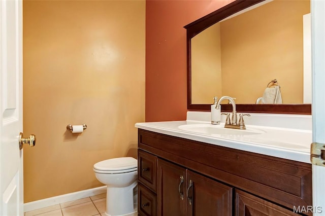 17560 Old Jamestown Rd, Florissant, MO 63034 - half bathroom featuring vanity, toilet, tile patterned floors, and baseboards