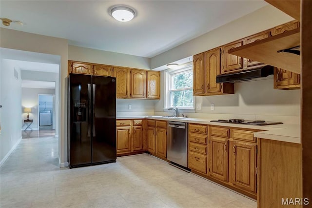 17560 Old Jamestown Rd, Florissant, MO 63034 - kitchen with black fridge with ice dispenser, stainless steel dishwasher, under cabinet range hood, a sink, and brown cabinets