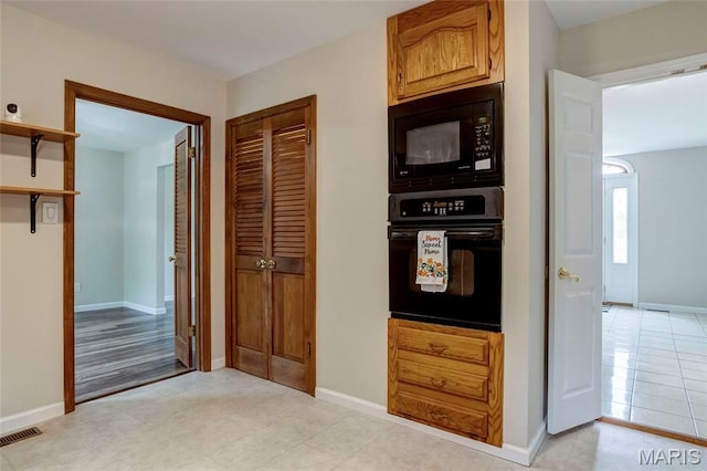 17560 Old Jamestown Rd, Florissant, MO 63034 - kitchen featuring black appliances, baseboards, and open shelves