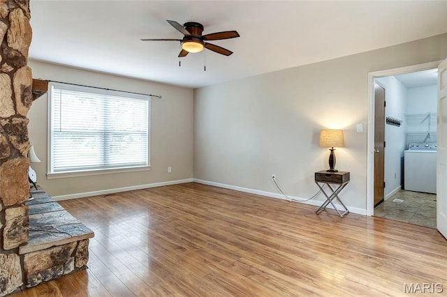 17560 Old Jamestown Rd, Florissant, MO 63034 - unfurnished living room with washer / dryer, a ceiling fan, light wood-style floors, and baseboards