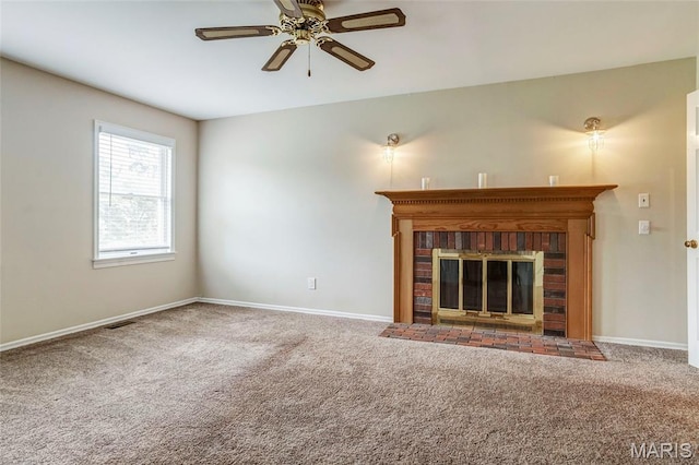 17560 Old Jamestown Rd, Florissant, MO 63034 - unfurnished living room featuring ceiling fan, carpet, a brick fireplace, and baseboards