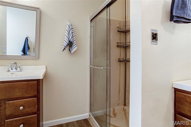 17560 Old Jamestown Rd, Florissant, MO 63034 - bathroom with vanity, a shower stall, and baseboards