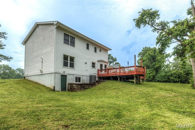 17560 Old Jamestown Rd, Florissant, MO 63034 - rear view of house with a wooden deck, a yard, and central AC unit