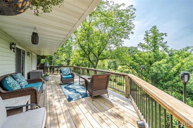 39 W Nottingham Cir, Sullivan, MO 63080 - deck featuring an outdoor hangout area, view of wooded area, and grilling area