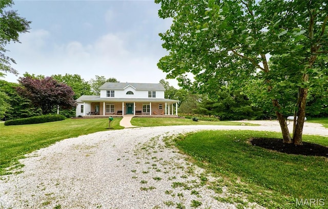 4 Hahn Estates Rd, Winfield, MO 63389 - view of front of property with a porch, curved driveway, and a front lawn