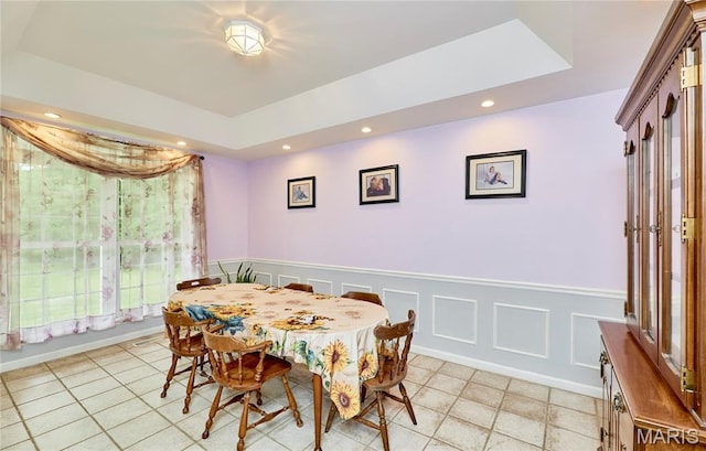 4 Hahn Estates Rd, Winfield, MO 63389 - dining space with a raised ceiling, recessed lighting, light tile patterned flooring, and wainscoting