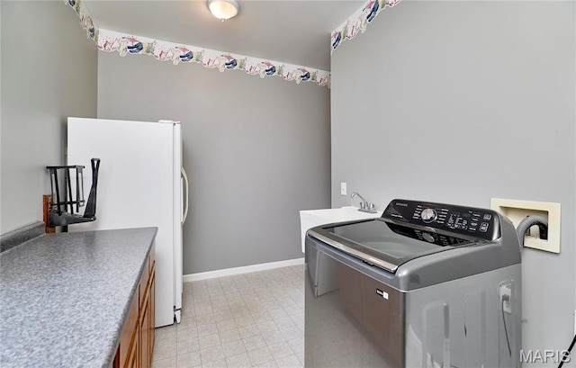 4 Hahn Estates Rd, Winfield, MO 63389 - washroom with washer / dryer and cabinet space