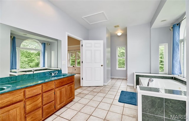 4 Hahn Estates Rd, Winfield, MO 63389 - full bath with tile patterned floors, double vanity, and a bath