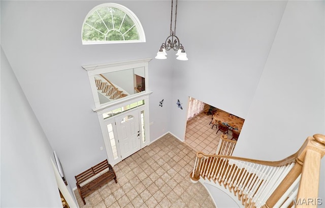 4 Hahn Estates Rd, Winfield, MO 63389 - entryway with a chandelier and baseboards