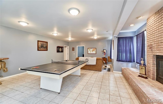 4 Hahn Estates Rd, Winfield, MO 63389 - game room featuring light tile patterned floors and a fireplace