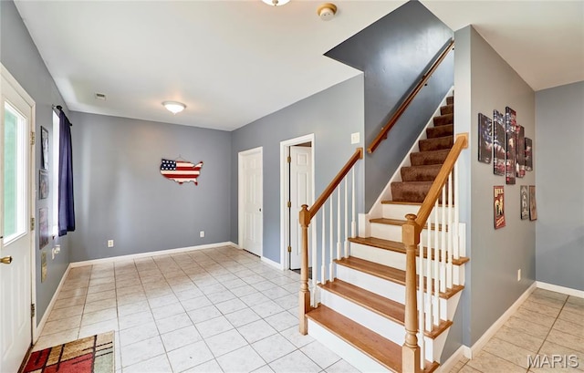 4 Hahn Estates Rd, Winfield, MO 63389 - staircase with tile patterned flooring and baseboards