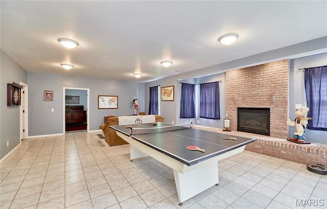 4 Hahn Estates Rd, Winfield, MO 63389 - recreation room with light tile patterned floors and a brick fireplace