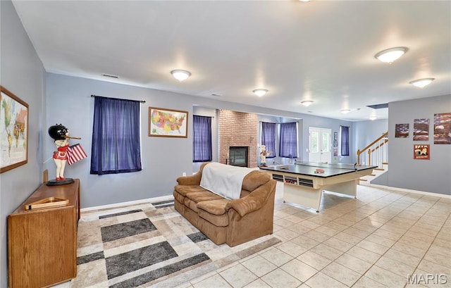 4 Hahn Estates Rd, Winfield, MO 63389 - living area with stairs, light tile patterned floors, and a fireplace