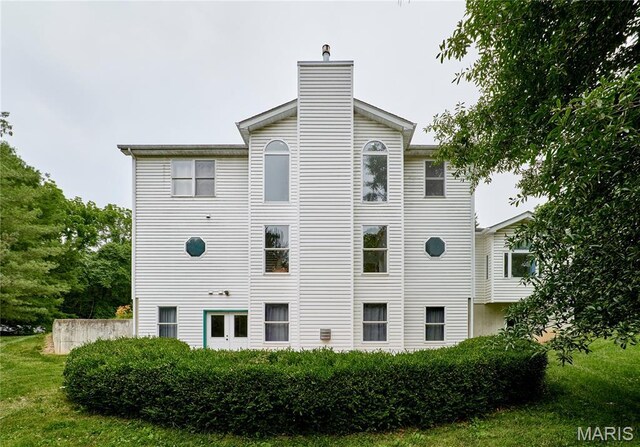 4 Hahn Estates Rd, Winfield, MO 63389 - back of house featuring a chimney