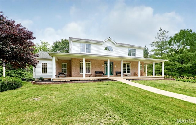 4 Hahn Estates Rd, Winfield, MO 63389 - view of front of home with a porch, a front yard, and brick siding