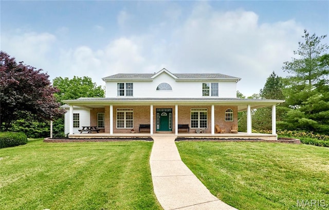 4 Hahn Estates Rd, Winfield, MO 63389 - view of front facade with covered porch and a front yard