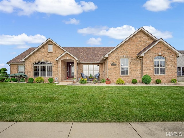 4184 Red Field Dr, Swansea, IL 62226 - view of front of house with a front lawn, brick siding, and a shingled roof