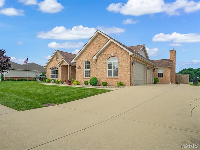 4184 Red Field Dr, Swansea, IL 62226 - ranch-style home with brick siding, a front lawn, a chimney, driveway, and a garage