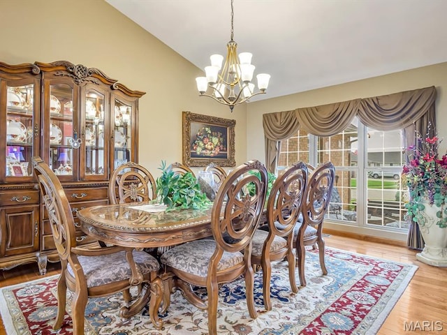 4184 Red Field Dr, Swansea, IL 62226 - dining area with a chandelier, light wood finished floors, and lofted ceiling