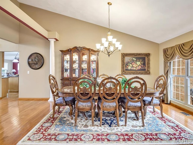 4184 Red Field Dr, Swansea, IL 62226 - dining space featuring wood finished floors, a chandelier, and vaulted ceiling