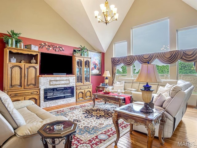 4184 Red Field Dr, Swansea, IL 62226 - living room with a chandelier, wood finished floors, a fireplace, and high vaulted ceiling