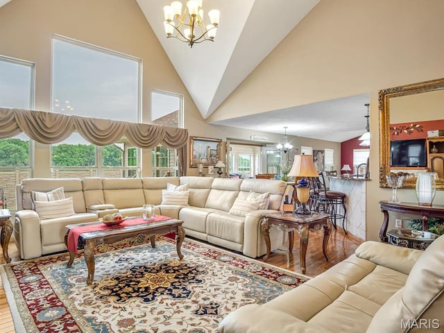 4184 Red Field Dr, Swansea, IL 62226 - living area featuring a chandelier, wood finished floors, and high vaulted ceiling