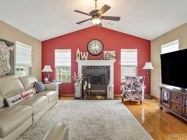 4184 Red Field Dr, Swansea, IL 62226 - living area featuring wood finished floors, a ceiling fan, a fireplace, and vaulted ceiling