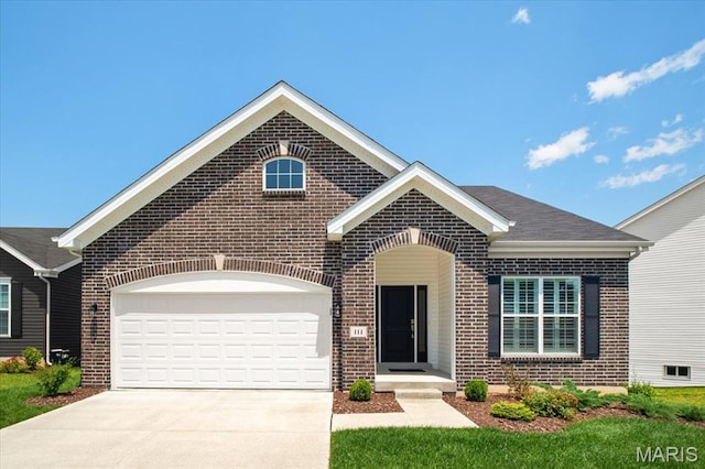 111 Creek Haven Ct, Lake St Louis, MO 63367 - view of front of home featuring brick siding, driveway, and a garage