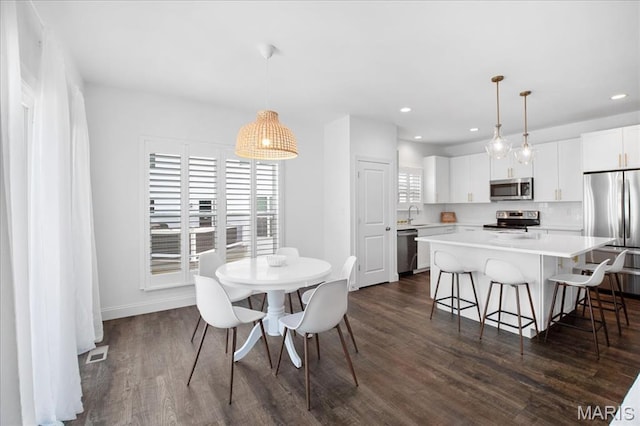 111 Creek Haven Ct, Lake St Louis, MO 63367 - dining space featuring recessed lighting, dark wood-style flooring, and baseboards