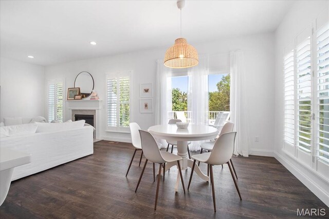 111 Creek Haven Ct, Lake St Louis, MO 63367 - dining area with healthy amount of natural light, dark wood-style flooring, a fireplace, recessed lighting, and baseboards