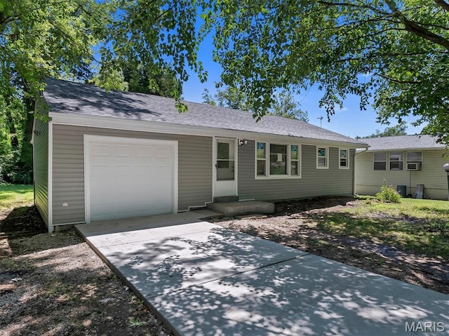 1216 Redman Blvd, Saint Louis, MO 63138 - single story home with a garage, driveway, and roof with shingles