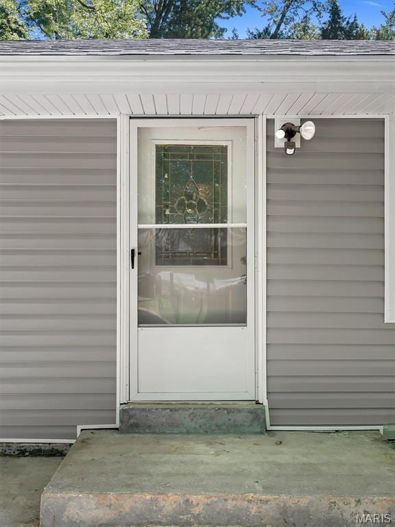 1216 Redman Blvd, Saint Louis, MO 63138 - doorway to property featuring roof with shingles