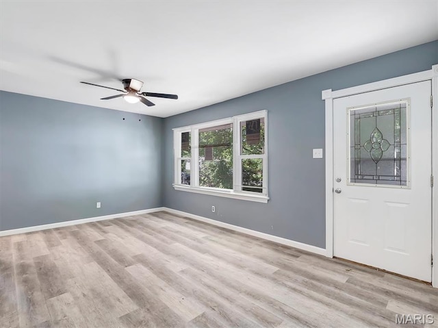 1216 Redman Blvd, Saint Louis, MO 63138 - foyer entrance with light wood-style floors and ceiling fan