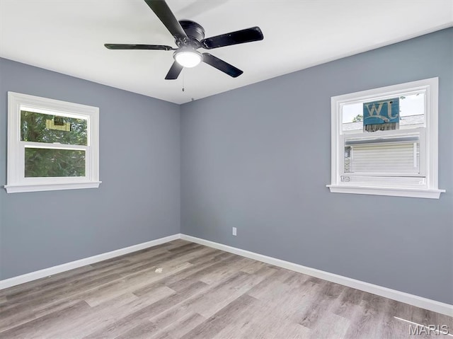 1216 Redman Blvd, Saint Louis, MO 63138 - empty room with healthy amount of natural light, wood finished floors, and a ceiling fan