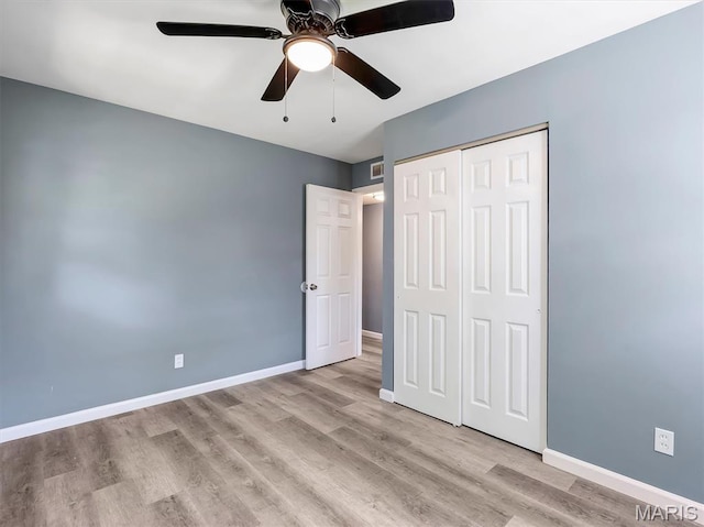 1216 Redman Blvd, Saint Louis, MO 63138 - unfurnished bedroom with light wood-style flooring, a closet, and a ceiling fan