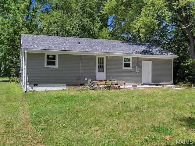 1216 Redman Blvd, Saint Louis, MO 63138 - rear view of house with a yard