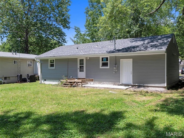 1216 Redman Blvd, Saint Louis, MO 63138 - rear view of house with a yard, roof with shingles, and a patio area