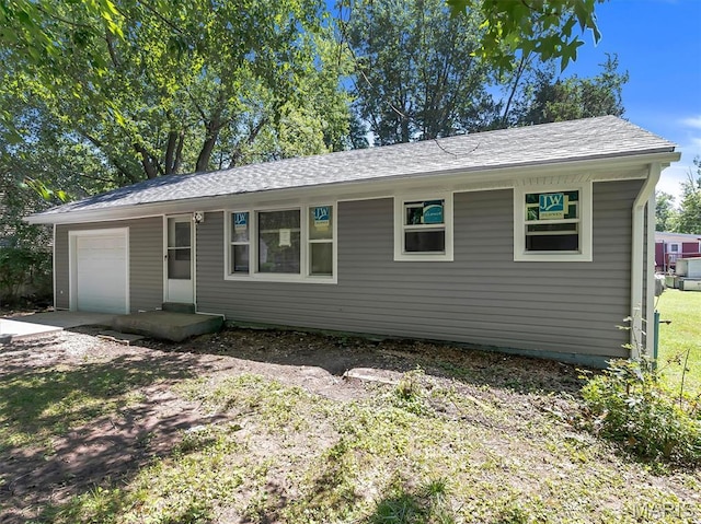 1216 Redman Blvd, Saint Louis, MO 63138 - single story home featuring an attached garage, roof with shingles, and driveway