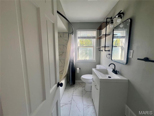 2328 Rockdale Ave, Saint Louis, MO 63121 - full bath featuring marble finish flooring, toilet, vanity, and shower / bath combination with curtain