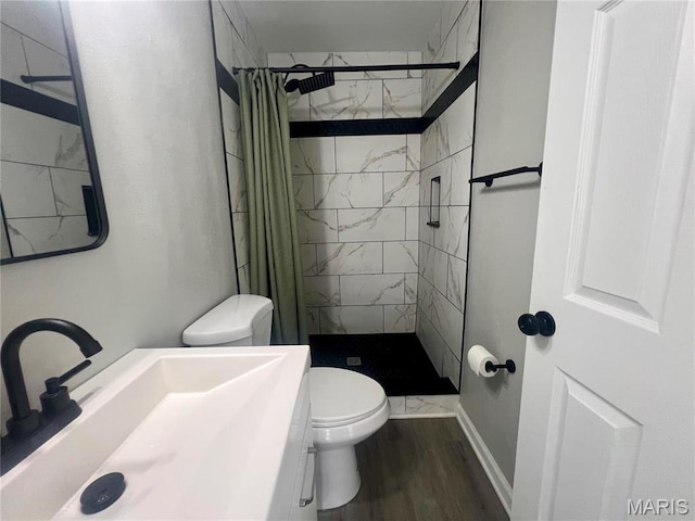 2328 Rockdale Ave, Saint Louis, MO 63121 - full bathroom featuring toilet, a stall shower, wood finished floors, and vanity