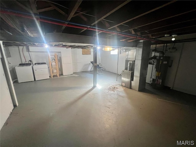 2328 Rockdale Ave, Saint Louis, MO 63121 - unfinished basement featuring water heater, washer and dryer, and heating unit