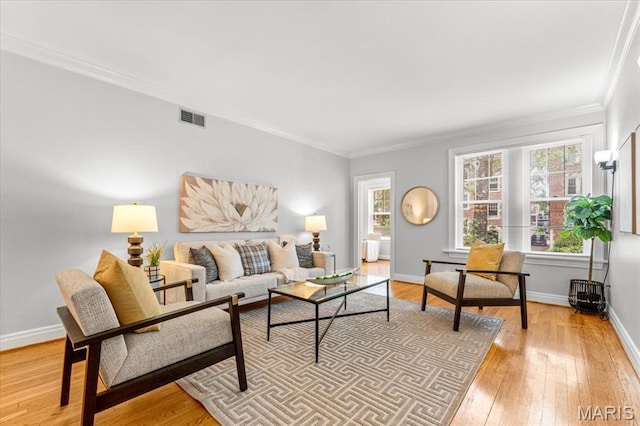 6318 Southwood Ave Unit 1W, Saint Louis, MO 63105 - living room featuring light wood-type flooring, crown molding, and baseboards