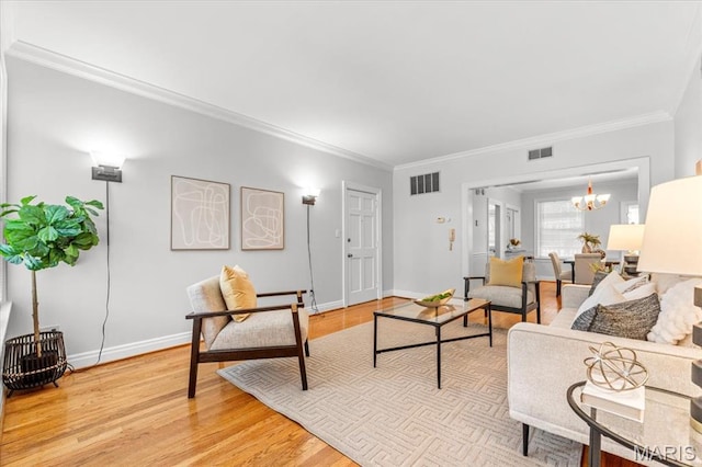 6318 Southwood Ave Unit 1W, Saint Louis, MO 63105 - living area with ornamental molding, light wood finished floors, a chandelier, and baseboards