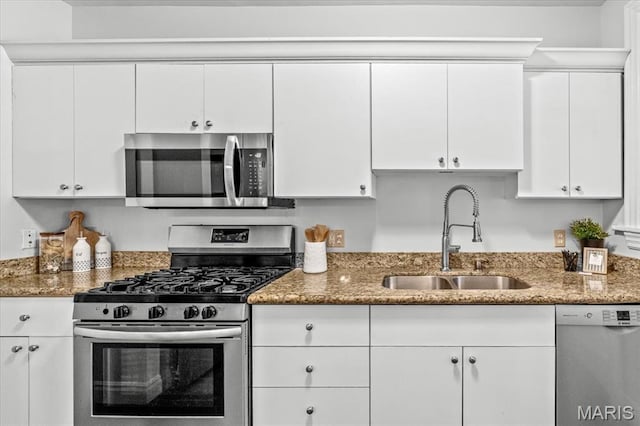 6318 Southwood Ave Unit 1W, Saint Louis, MO 63105 - kitchen with appliances with stainless steel finishes, a sink, and white cabinetry