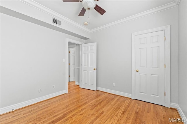 6318 Southwood Ave Unit 1W, Saint Louis, MO 63105 - unfurnished bedroom with crown molding, baseboards, light wood-type flooring, and a ceiling fan